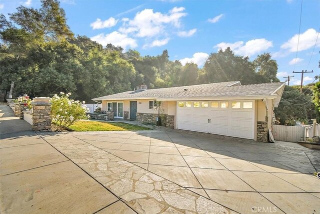 ranch-style home featuring a garage