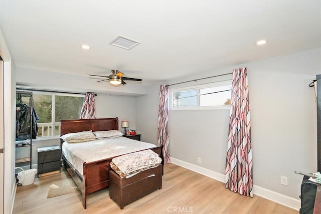 bedroom with light wood-type flooring and ceiling fan