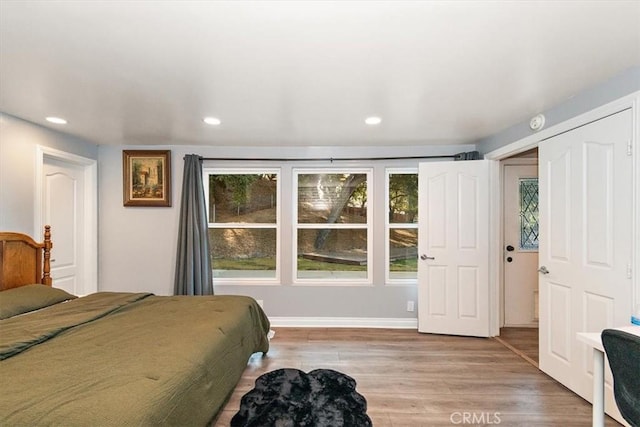 bedroom with light hardwood / wood-style floors