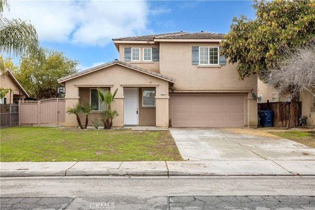 traditional-style house with stucco siding, a gate, fence, an attached garage, and a front yard