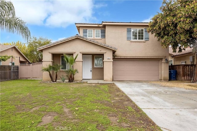 traditional-style home featuring stucco siding, driveway, and fence