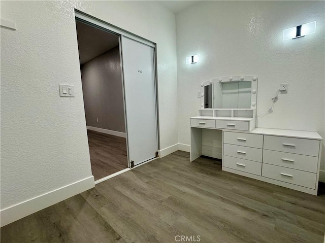 bathroom featuring hardwood / wood-style flooring and vanity