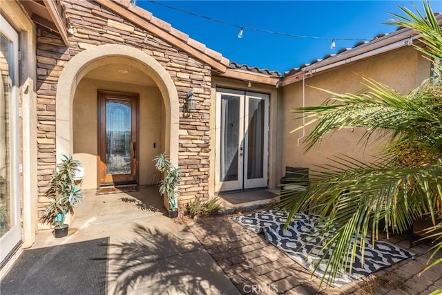 view of exterior entry with french doors