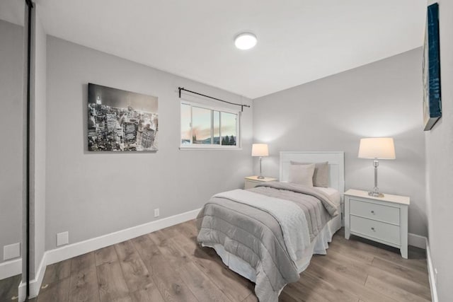 bedroom with light wood-type flooring