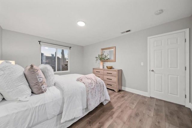 bedroom with wood-type flooring