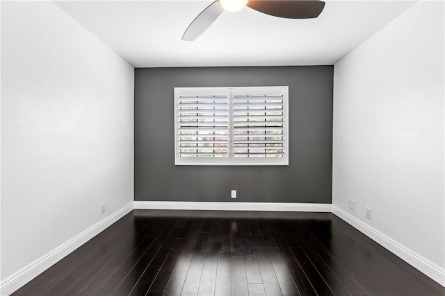 empty room featuring ceiling fan and dark hardwood / wood-style floors