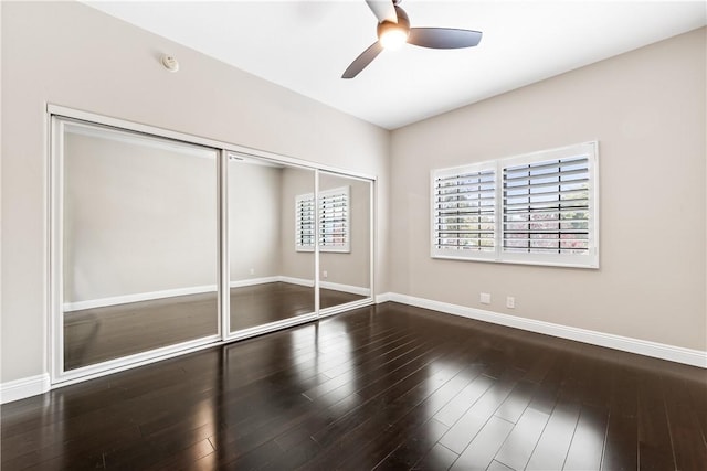 unfurnished bedroom with ceiling fan, hardwood / wood-style floors, and a closet