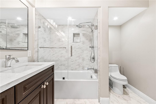 full bathroom with combined bath / shower with glass door, vanity, and toilet