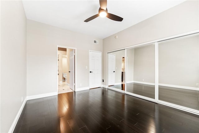 empty room with ceiling fan and hardwood / wood-style floors