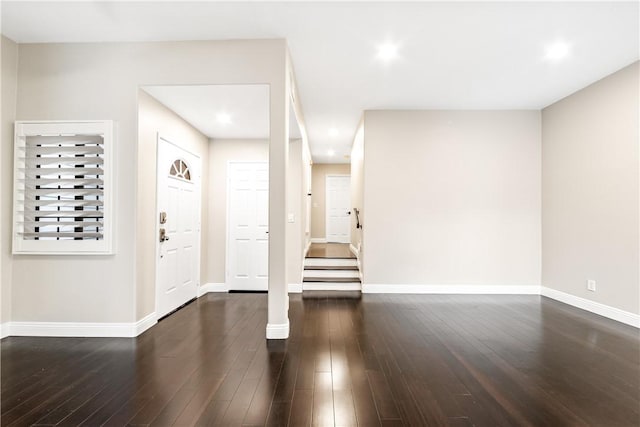 entrance foyer with dark hardwood / wood-style floors