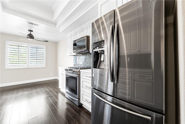 kitchen with ceiling fan, white cabinets, decorative backsplash, and stainless steel appliances