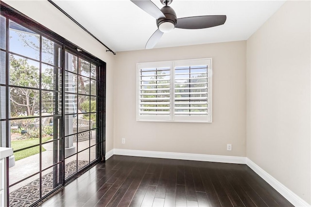 unfurnished room with ceiling fan and dark hardwood / wood-style flooring