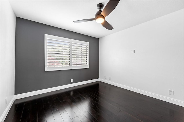 spare room featuring ceiling fan and dark hardwood / wood-style floors