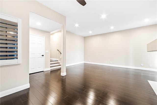 spare room with dark wood-type flooring