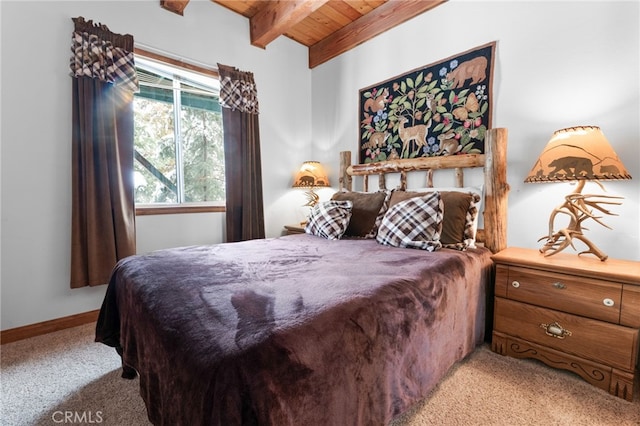 carpeted bedroom with wooden ceiling and lofted ceiling with beams