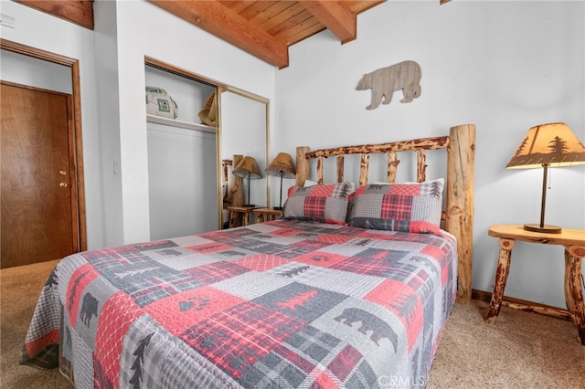 bedroom with light carpet, a closet, wood ceiling, and beam ceiling