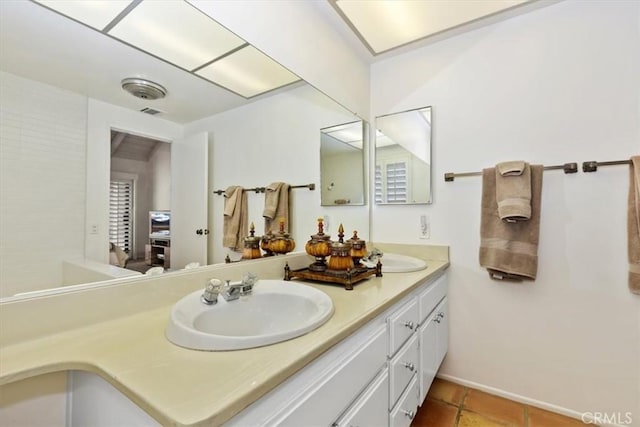 bathroom with vanity and tile patterned floors