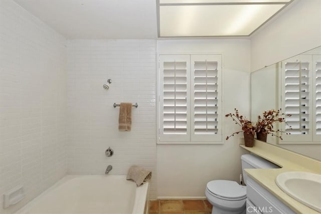 bathroom with toilet, a bathing tub, tile patterned flooring, and vanity