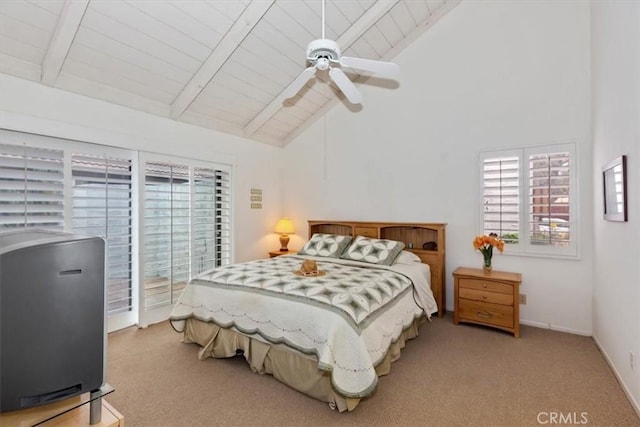 bedroom featuring ceiling fan, beam ceiling, light colored carpet, and wooden ceiling