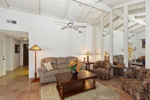 living room featuring beam ceiling, ceiling fan, tile patterned floors, and high vaulted ceiling