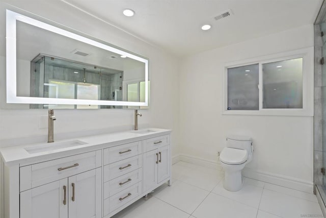 bathroom featuring walk in shower, vanity, toilet, and tile patterned flooring