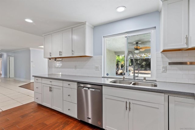 kitchen featuring white cabinetry and dishwasher