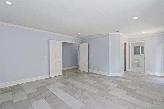 spare room with crown molding