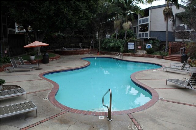 6405 Green Valley Cir Unit 209, Culver City, CA 90230 - community pool featuring a patio area and fence