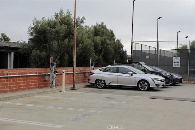 6405 Green Valley Cir Unit 209, Culver City, CA 90230 - uncovered parking lot featuring fence