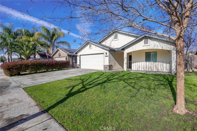 view of front of home with a front yard and a garage