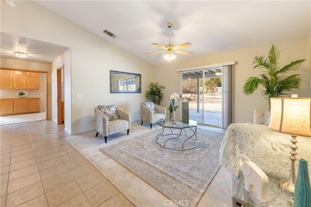 living room with vaulted ceiling, ceiling fan, and tile patterned flooring