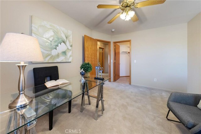 home office featuring ceiling fan and carpet flooring