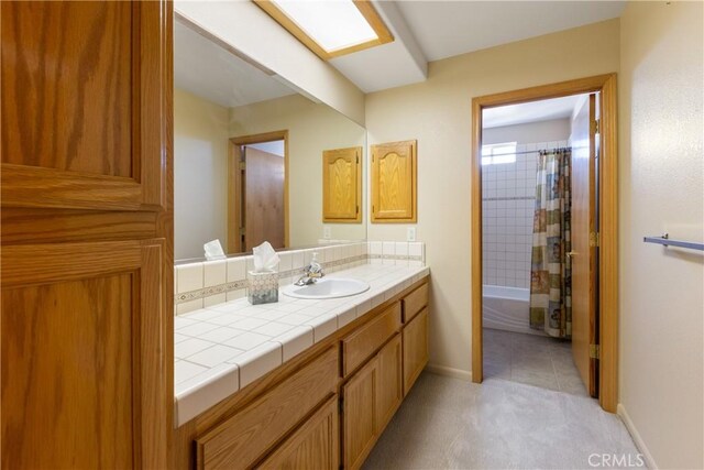 bathroom with shower / bathtub combination with curtain and vanity