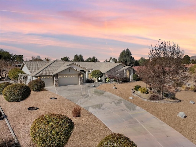 ranch-style house featuring a garage