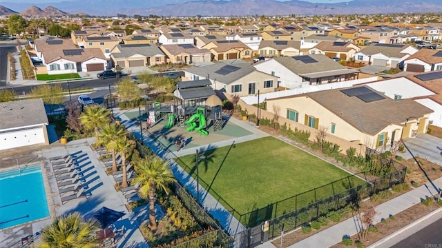 birds eye view of property featuring a mountain view