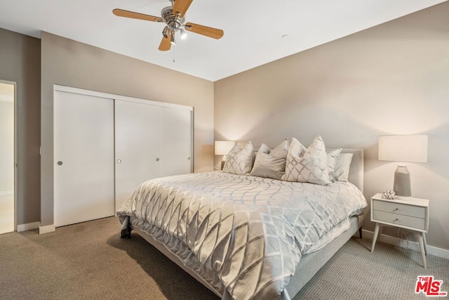 carpeted bedroom featuring a closet and ceiling fan