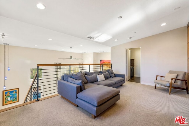 living room with ceiling fan and light colored carpet