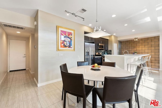 dining area with light tile patterned flooring