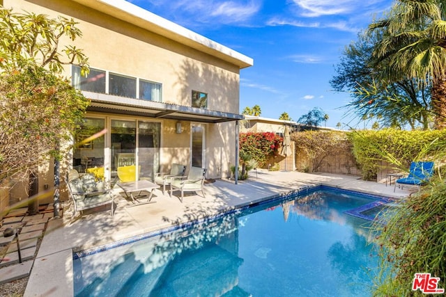 view of swimming pool featuring a patio