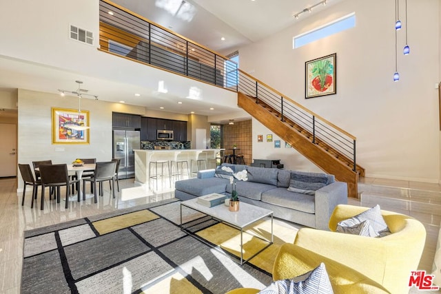 living room with a high ceiling