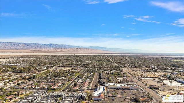 birds eye view of property featuring a mountain view