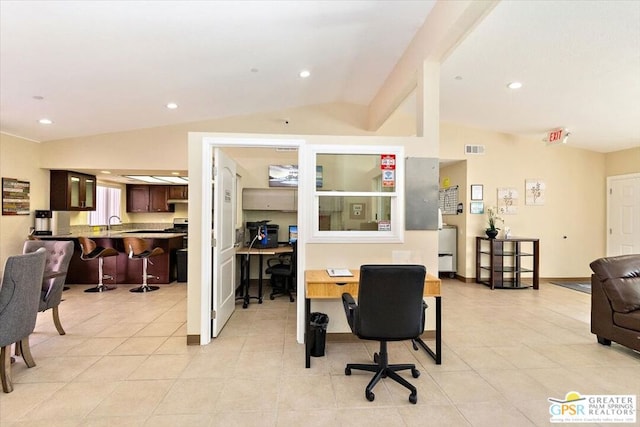 tiled office featuring lofted ceiling