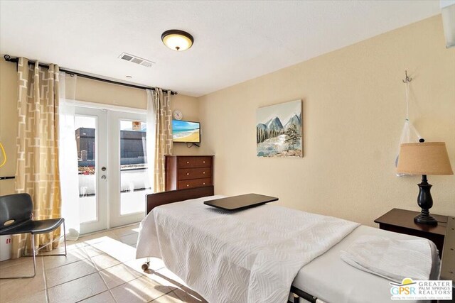 bedroom featuring light tile patterned floors, access to exterior, and french doors