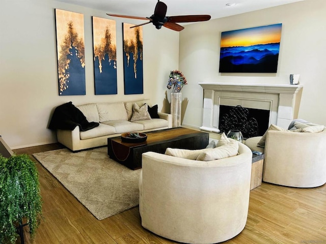 living room with ceiling fan and hardwood / wood-style floors