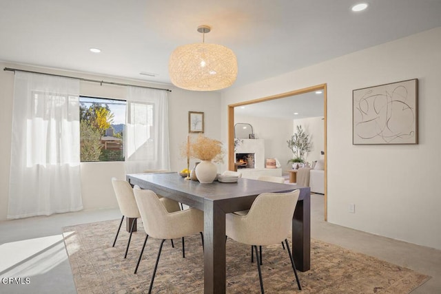 dining space featuring concrete flooring