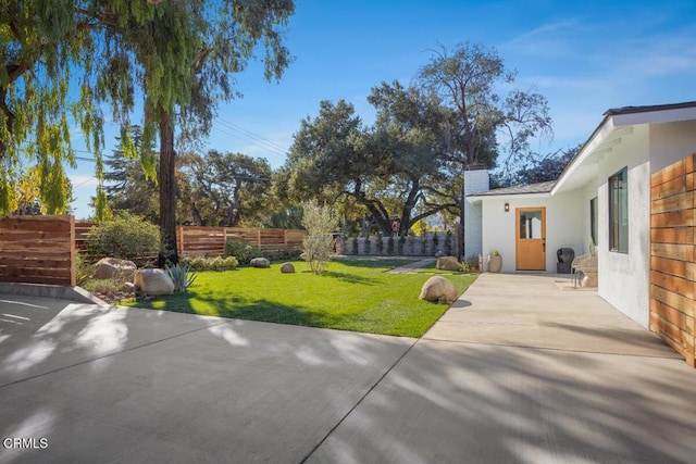 view of yard with a patio area and fence