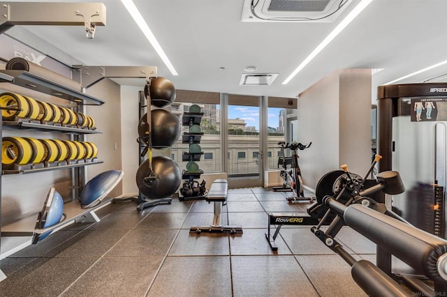 workout area featuring floor to ceiling windows