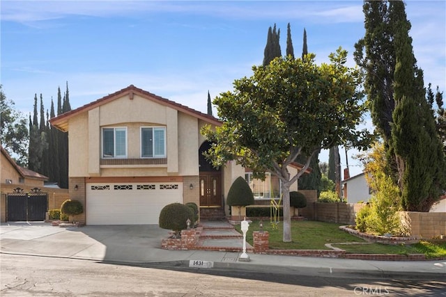 view of front of property with a front yard and a garage