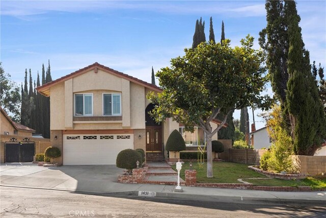 view of front of home featuring a garage and a front lawn