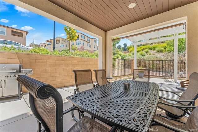 view of patio / terrace with a pergola and area for grilling